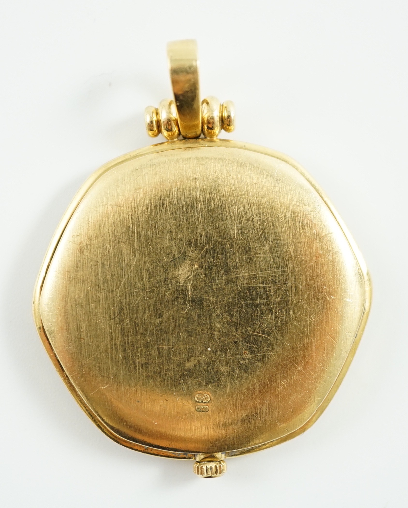 A modern 18ct gold and diamond set quartz shaped hexagonal pendant dress watch, retailed by Garrard